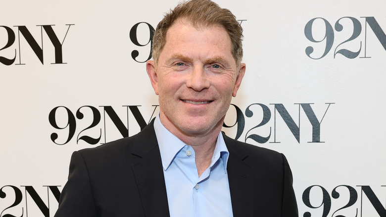 bobby flay smiling in suit and shirt
