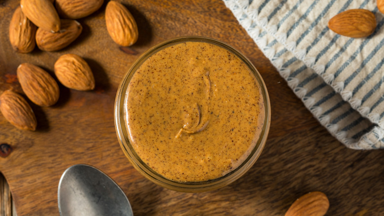 Jar of almond butter and almonds