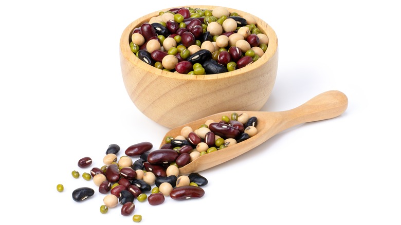 beans in a wooden bowl and scoop