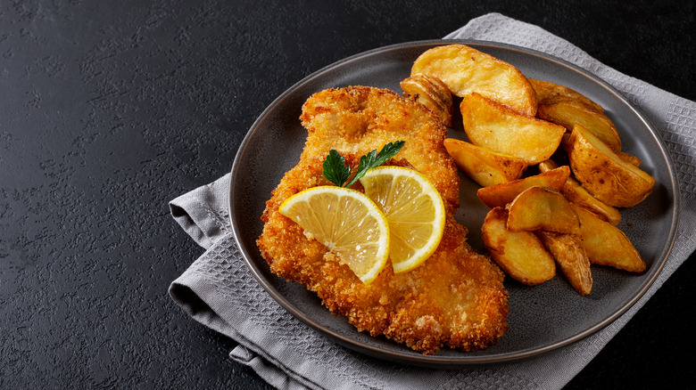 Plate of chicken schnitzel and potatoes