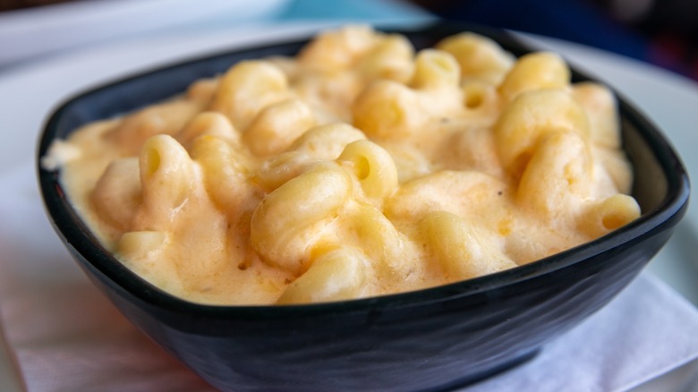 A black bowl of very Saucy spiral mac and cheese