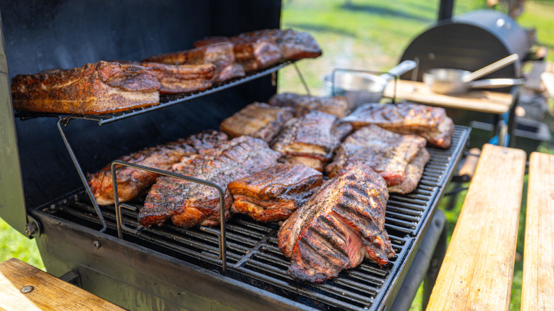 meat on barbecue smoker