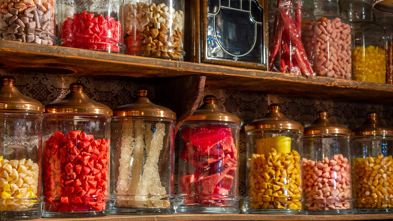 old-fashioned candies in glass jars on shelf