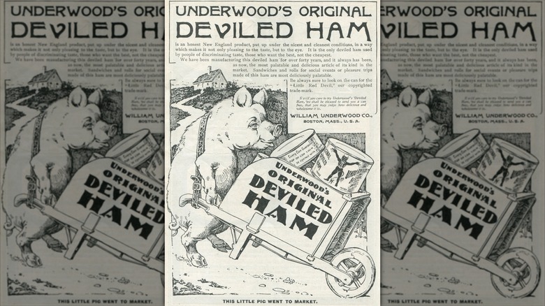 An old black-and-white advert for Underwood's Original Deviled Ham, portraying a pig pushing a wheelbarrow full of canned deviled ham