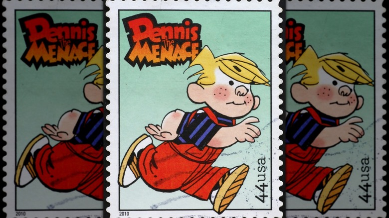 A postage stamp featuring the comic strip version of Dennis the Menace running