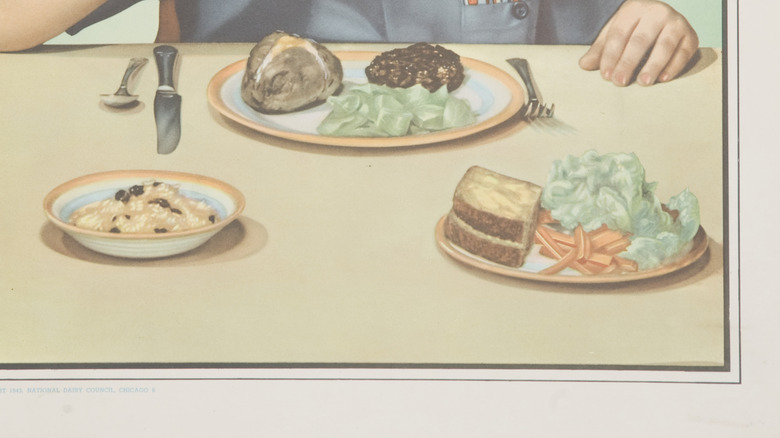 A 1950s poster from the National Dairy Council, closeup of child drinking milk with dinner