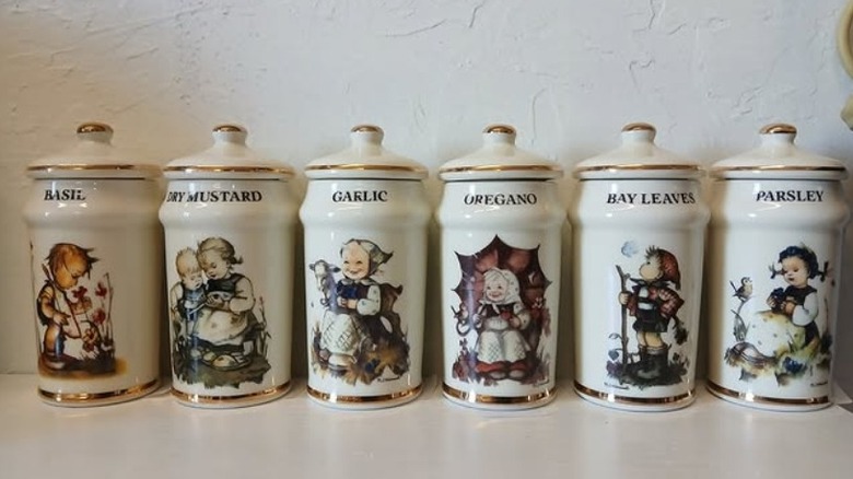 Row of assorted Hummel spice jars