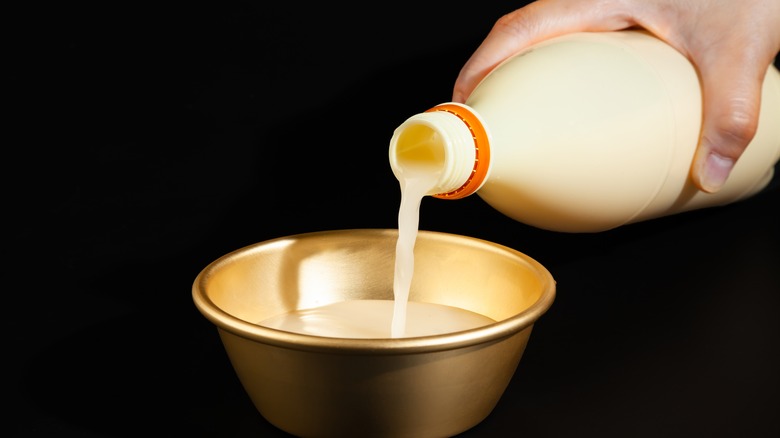 Makgeolli is poured into a bowl