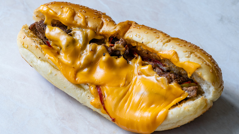 Philly cheesesteak slathered in cheese