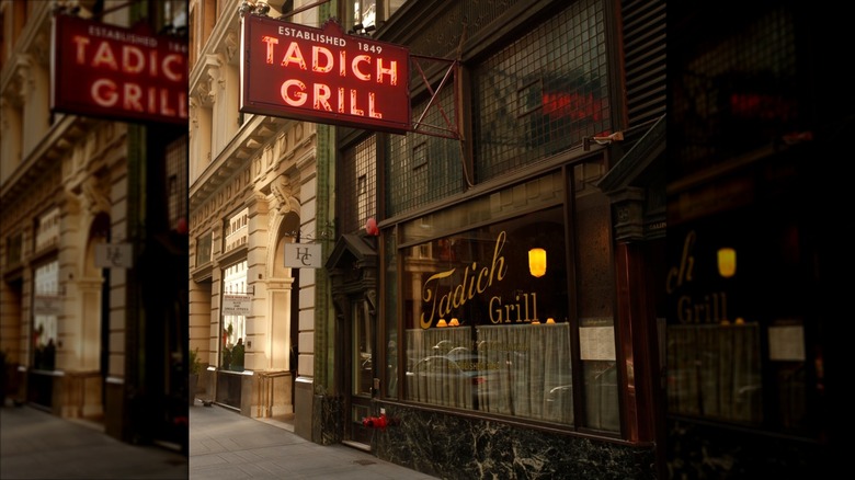 Outside sidewalk view fo the Tadich Grill with neon sign