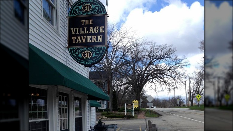 Outside The Village Tavern overlooking the roadway