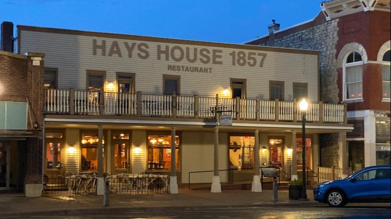 Outside Hays House with street lamps and porch lights on