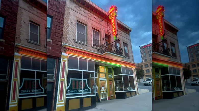 Outside the Pekin Cafe at dusk with neon sign lights glowing