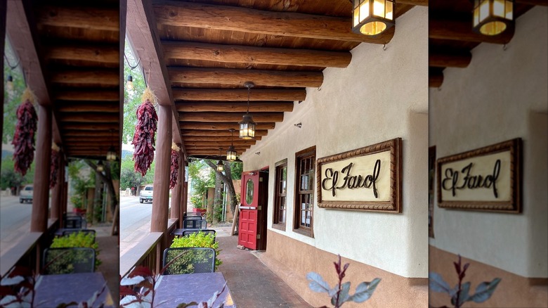 View from the porch of El Farol with live plants and drying peppers