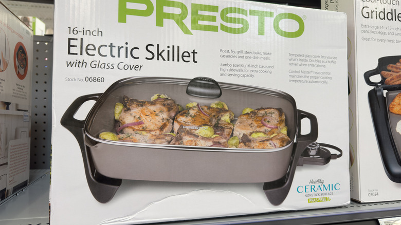 An electric skillet in a box on a shelf in the store
