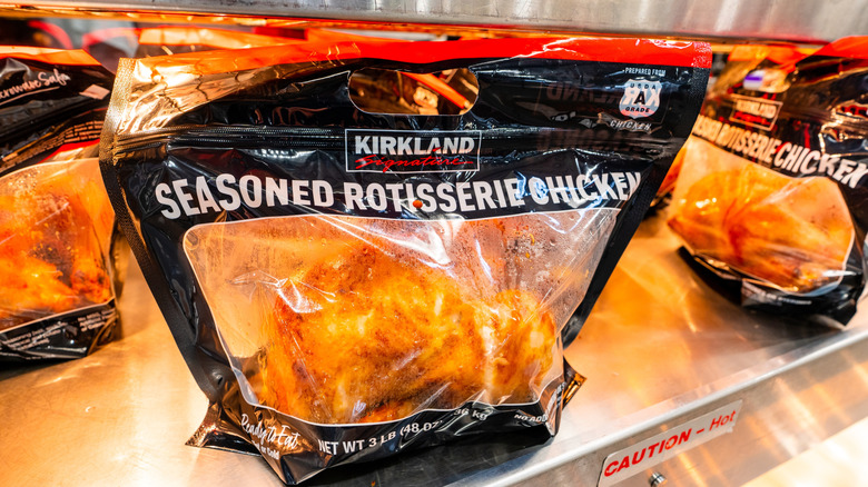 A sealed bag with rotisserie chicken at Costco, with condensation.