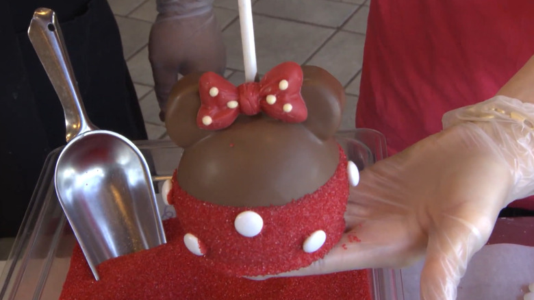 Minnie Mouse candy apple being made at disney