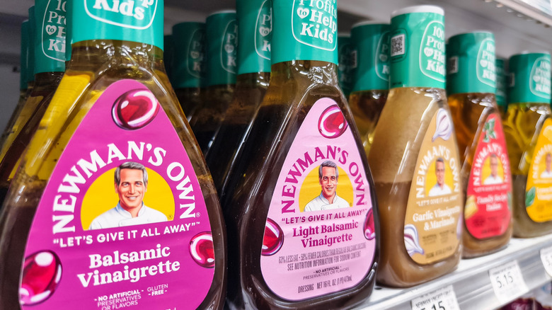 Newman's Own salad dressings on a shelf at a grocery store