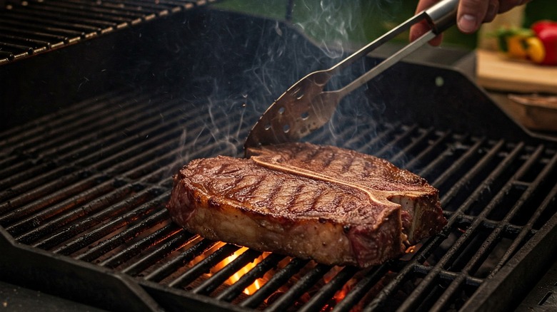 steak sizzling on grill