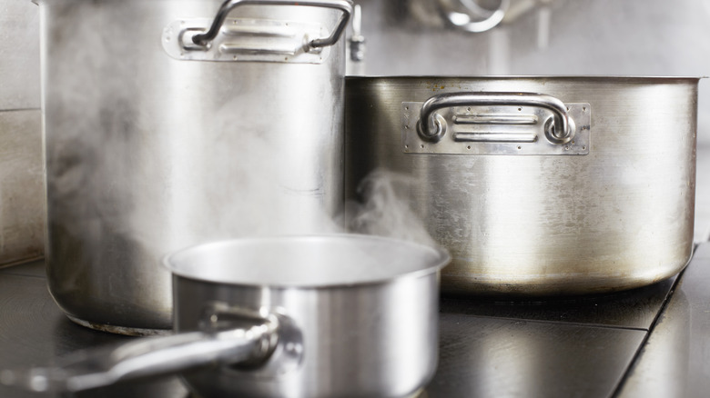 three pots of different sizes on a stove top