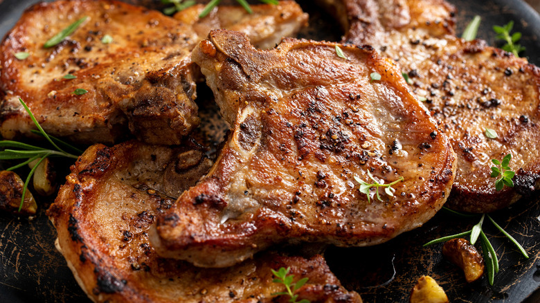 Pan fried pork chops with rosemary and garlic
