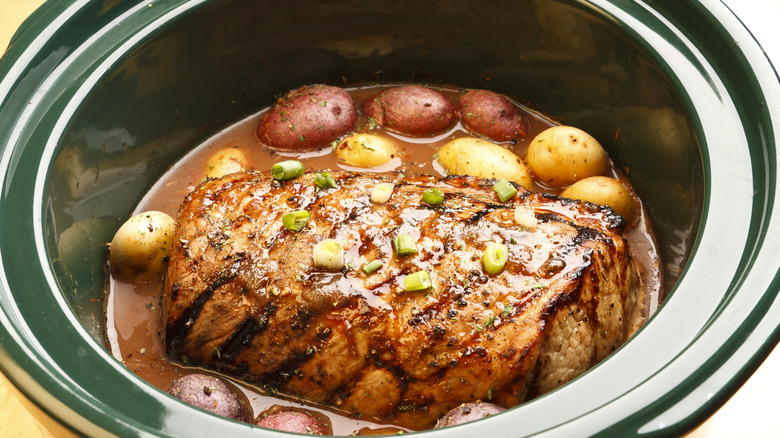 meat cooking in crock pot