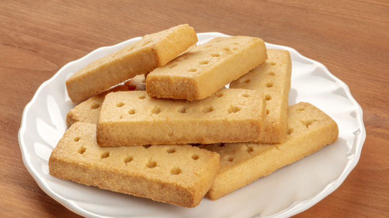 Pile of Scottish shortbread on a plate on a wooden table