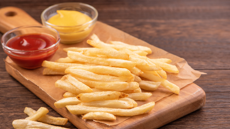 Fries with ketchup and mustard