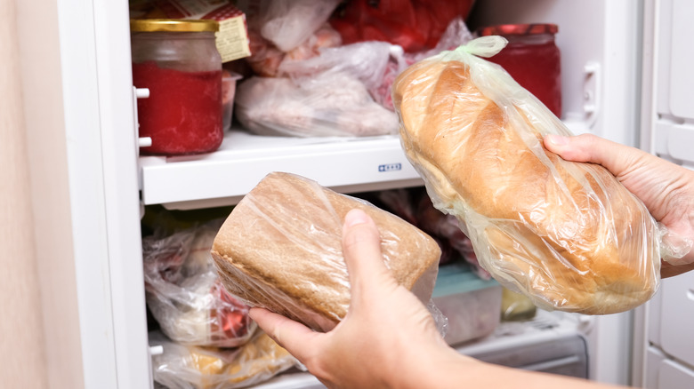 Bread being removed from freezer