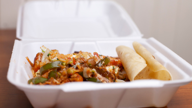 Leftover fajitas in a container