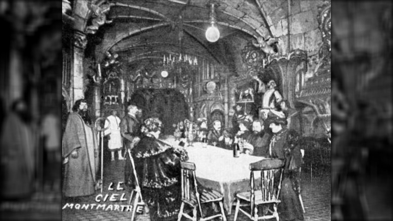 Sitting at a table in a cathedral-like room