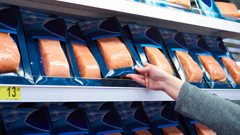 packages of salmon on grocery store shelf