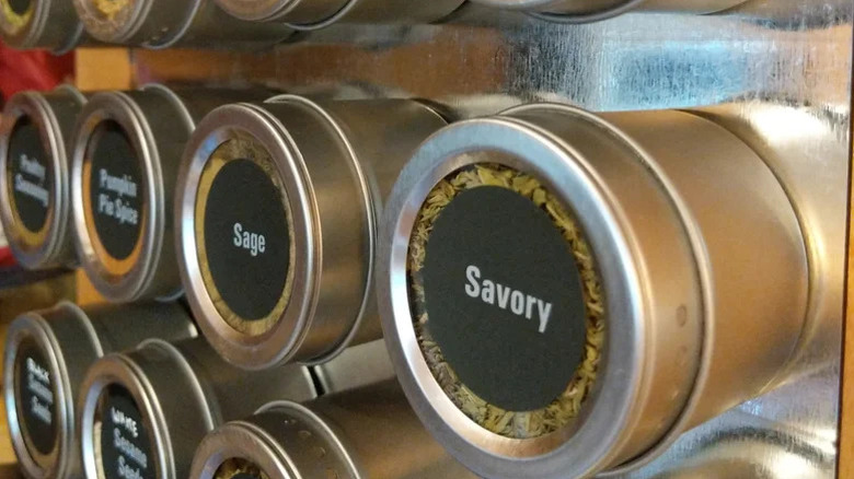 a close up of spices in magnetic metal tins