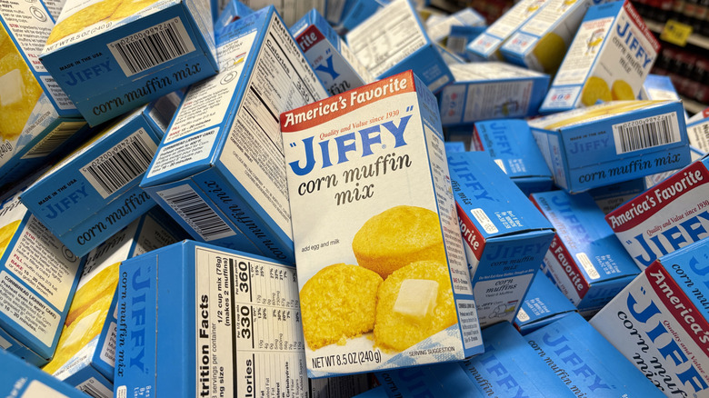 piles of Jiffy corn muffin mix boxes in store