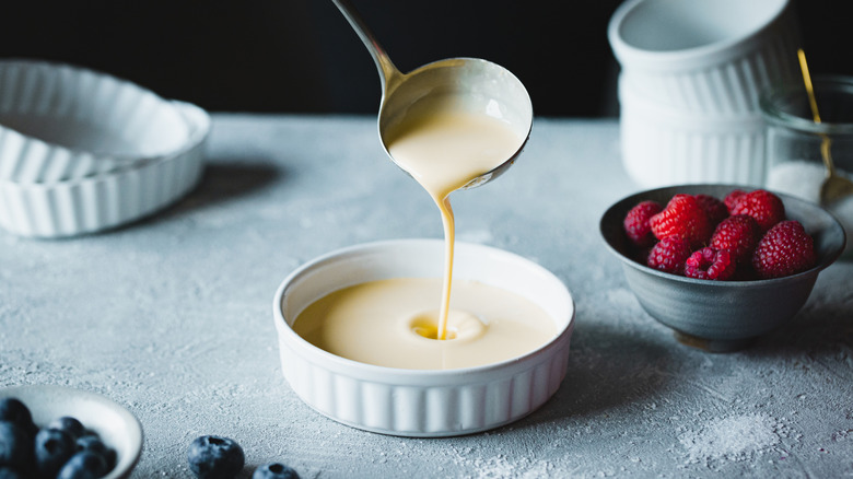 filling dish with custard