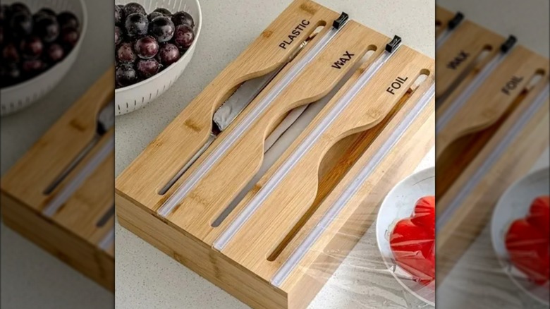 Plastic, wax, foil dispenser on kitchen counter