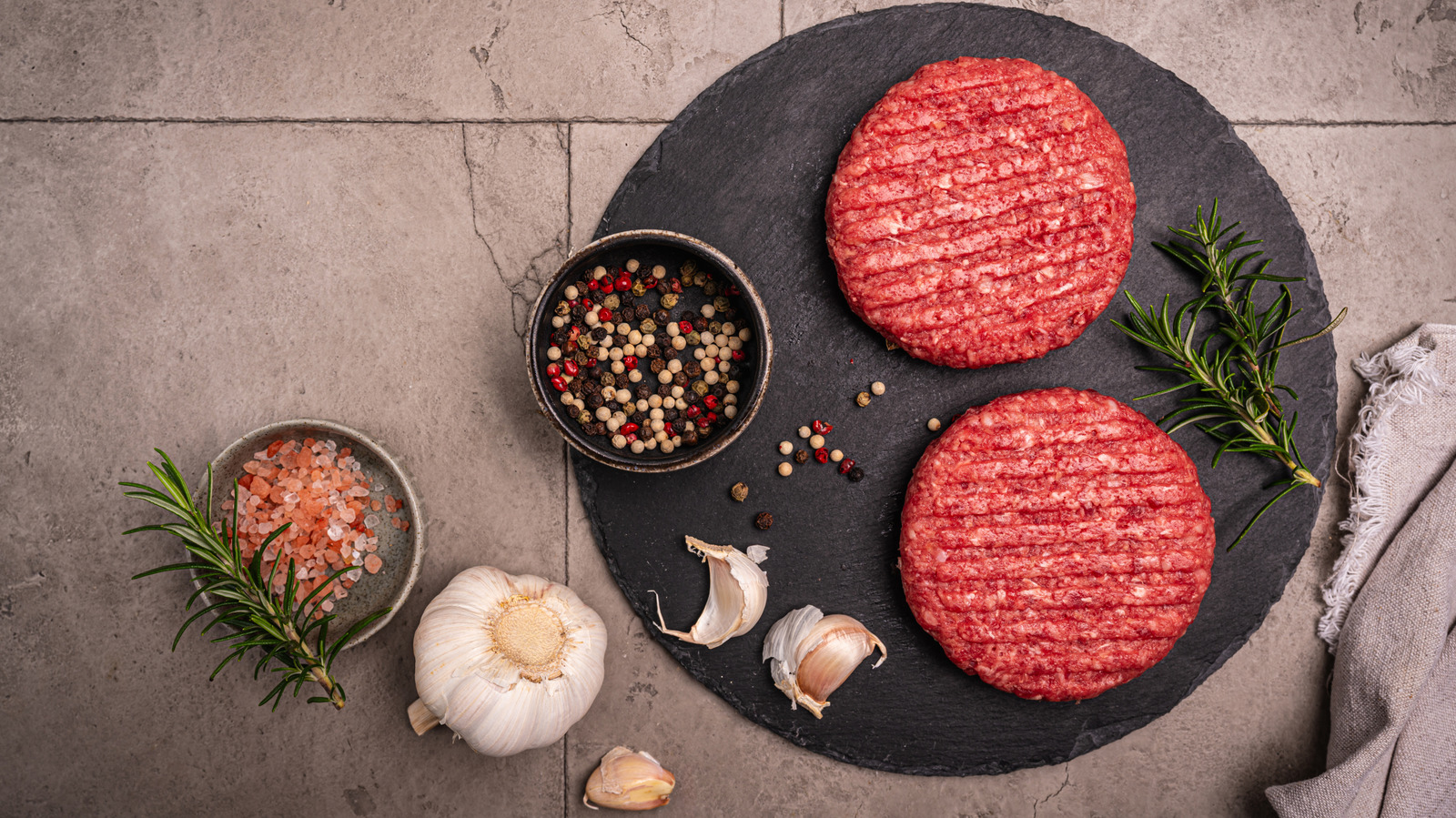 The Pepper Mistake You Might Be Making When Seasoning Burgers
