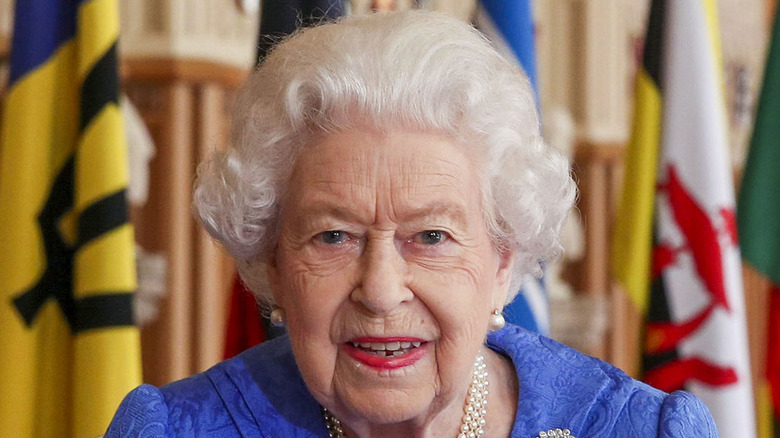 Queen wearing a blue suit