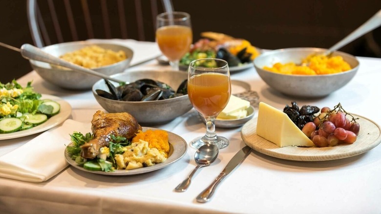 A dinner table laid with a Thanksgiving feast, served at the Plimoth Patuxet Museums