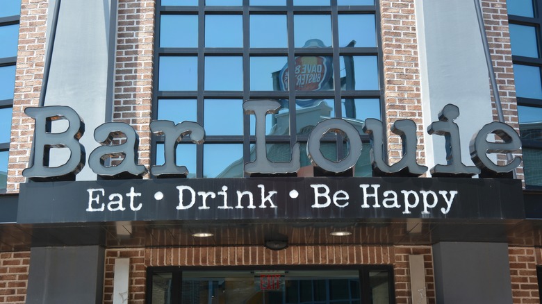 The exterior sign of a Bar Louie location above the words eat, drink, be happy