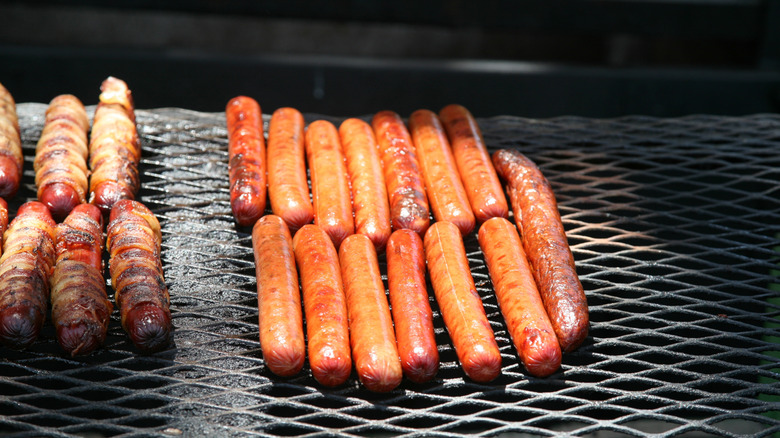 hot dogs on a grill
