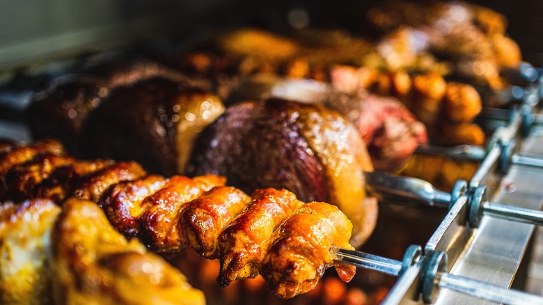 brazilian skewers cooking over fire