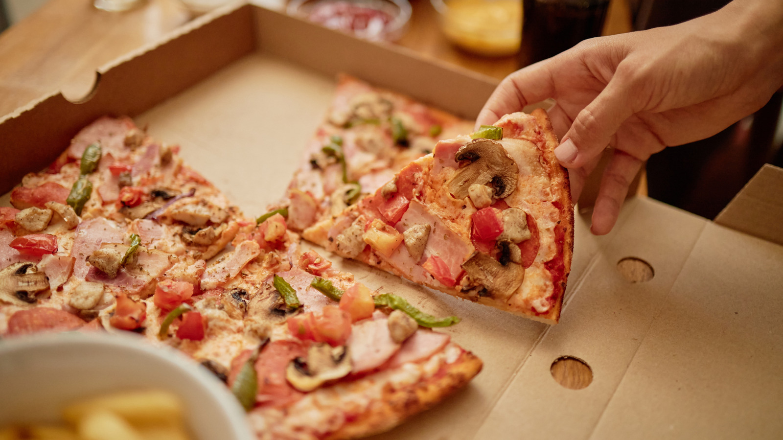 The Popular Pizza Chain You Might Be Able To Snag A Slice From At Walmart - Tasting Table