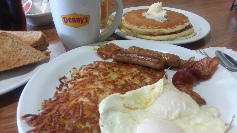 Crispy shredded hash brown potatoes with pancake and egg meal at Denny's