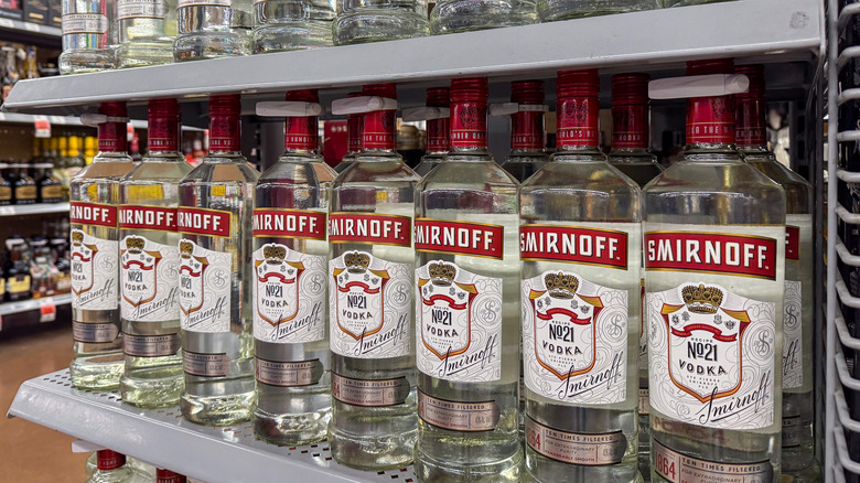 Row of Smirnoff vodka bottles on shelf