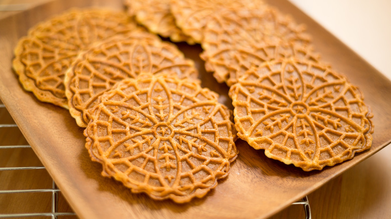 pizzelle cookies on wooden board