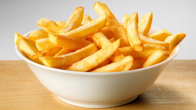 dish holding salted French Fries