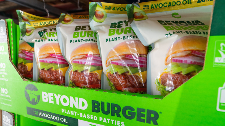 A box of wrapped Beyond Burgers on a grocery shelf
