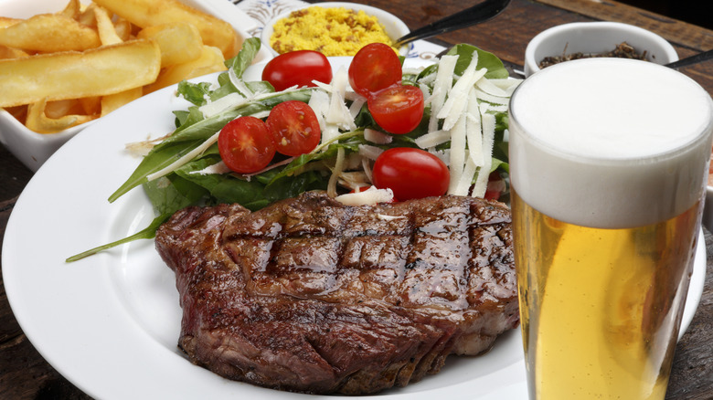 1980s prime rib with salad and pint of beer