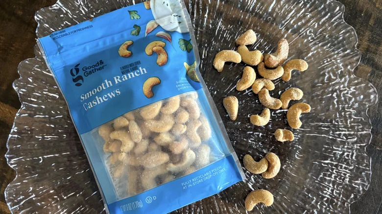 A bag of Good & Gather Smooth Ranch Cashews laying on a glass plate